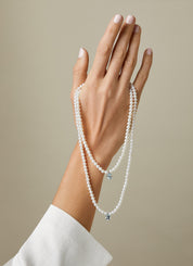 White gold pearl necklace, 0.60 ct aquamarijn, rivièra