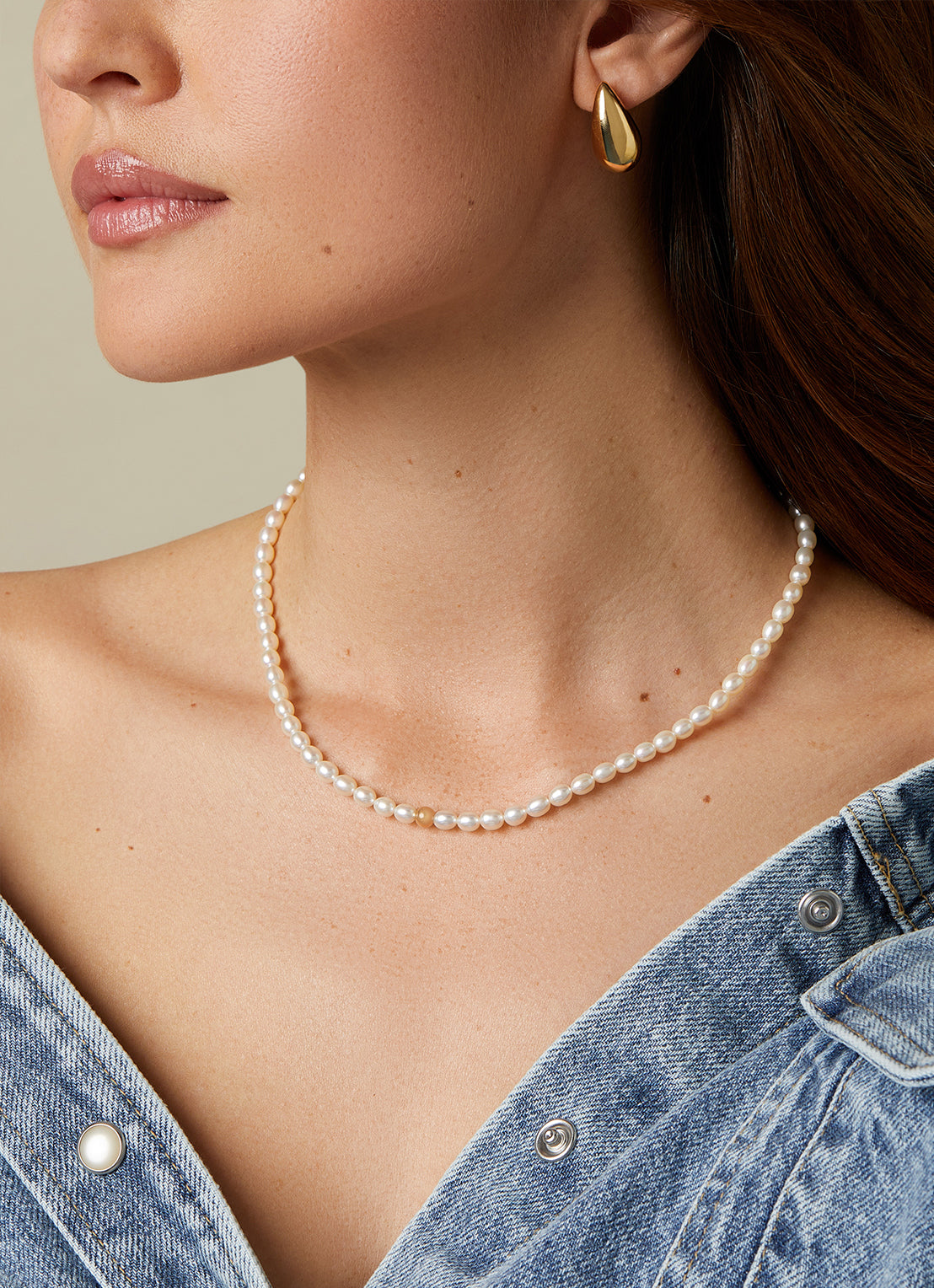 Yellow gold pearl chain rivièra